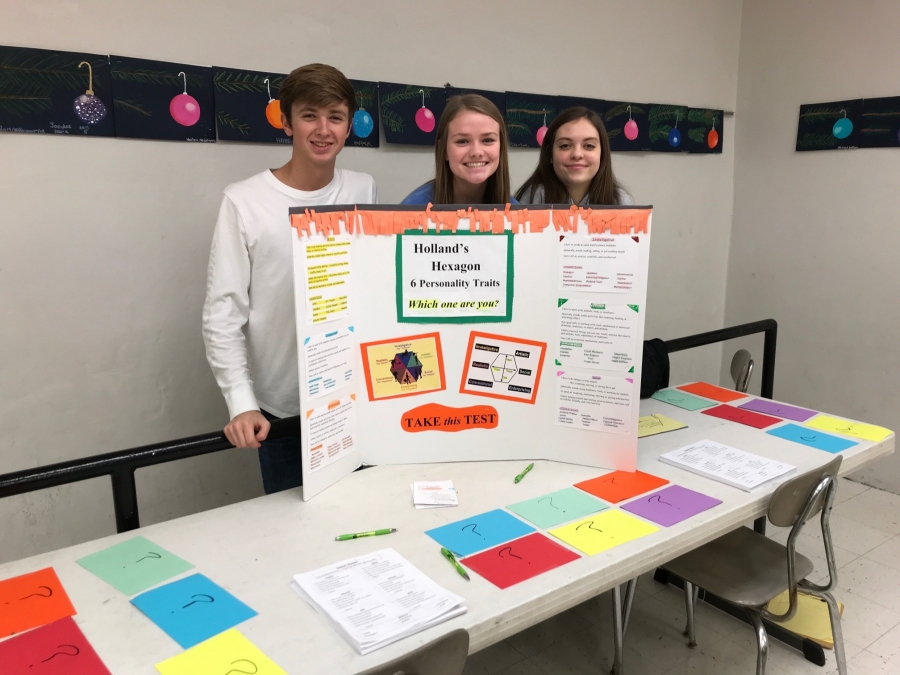 students behind a tri board project